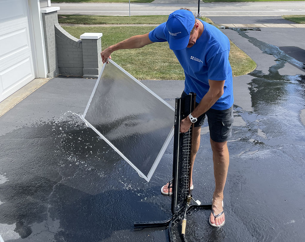 man washing screens