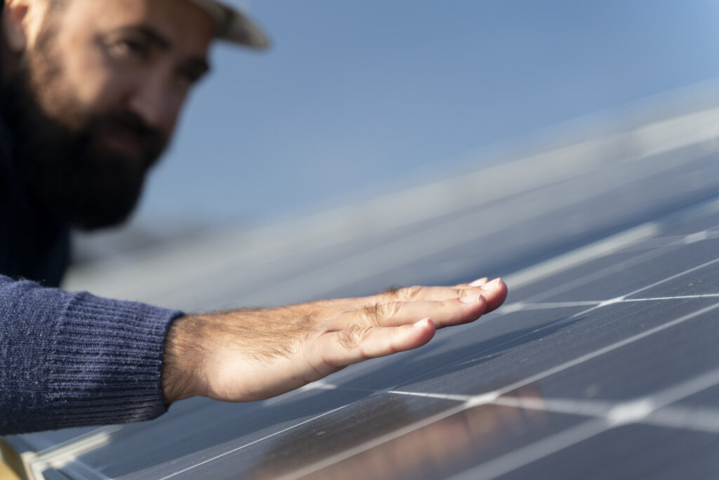 person near solar panels